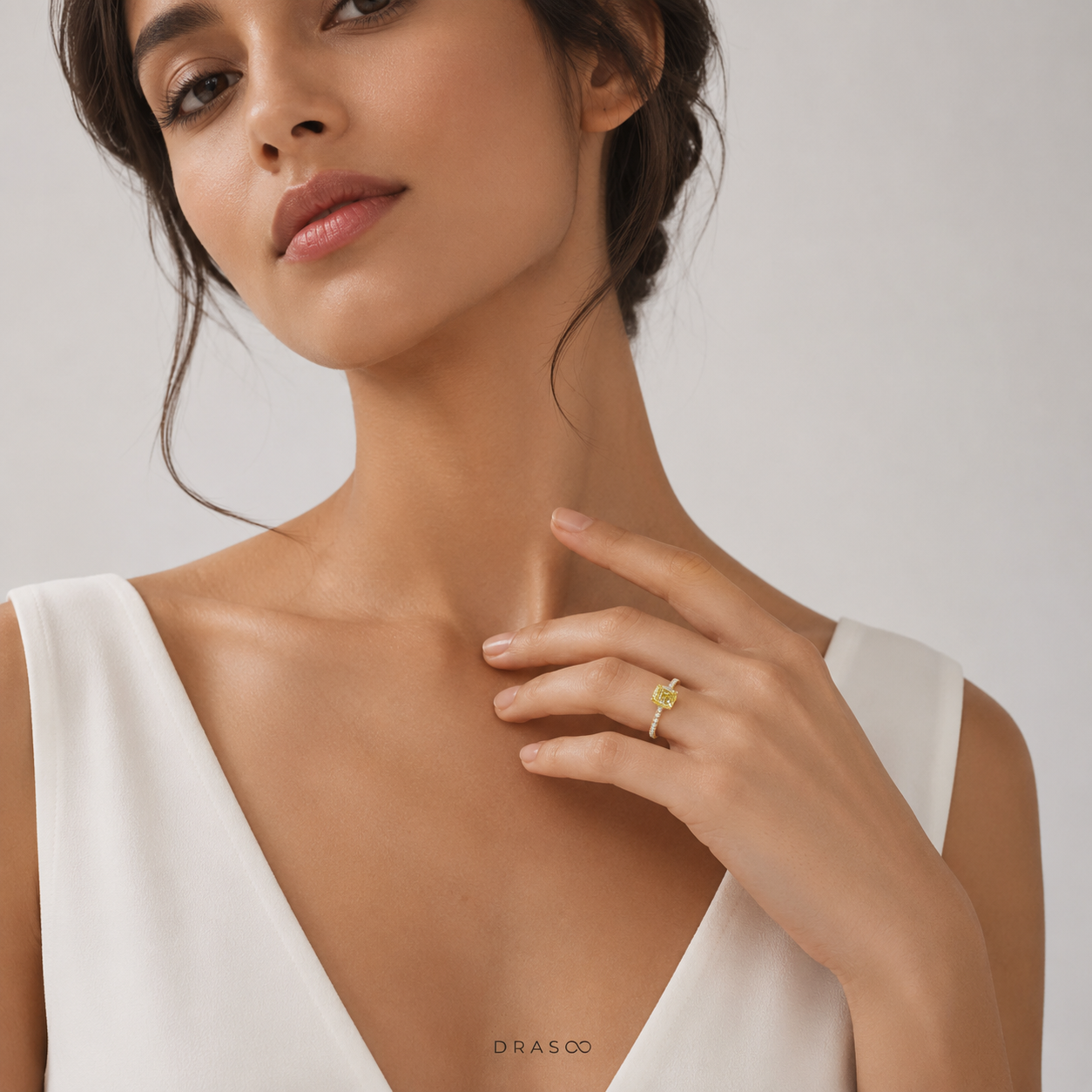 Engagement Ring with a Cushion-Cut Yellow Diamond and an 18K Yellow Gold Diamond Band
