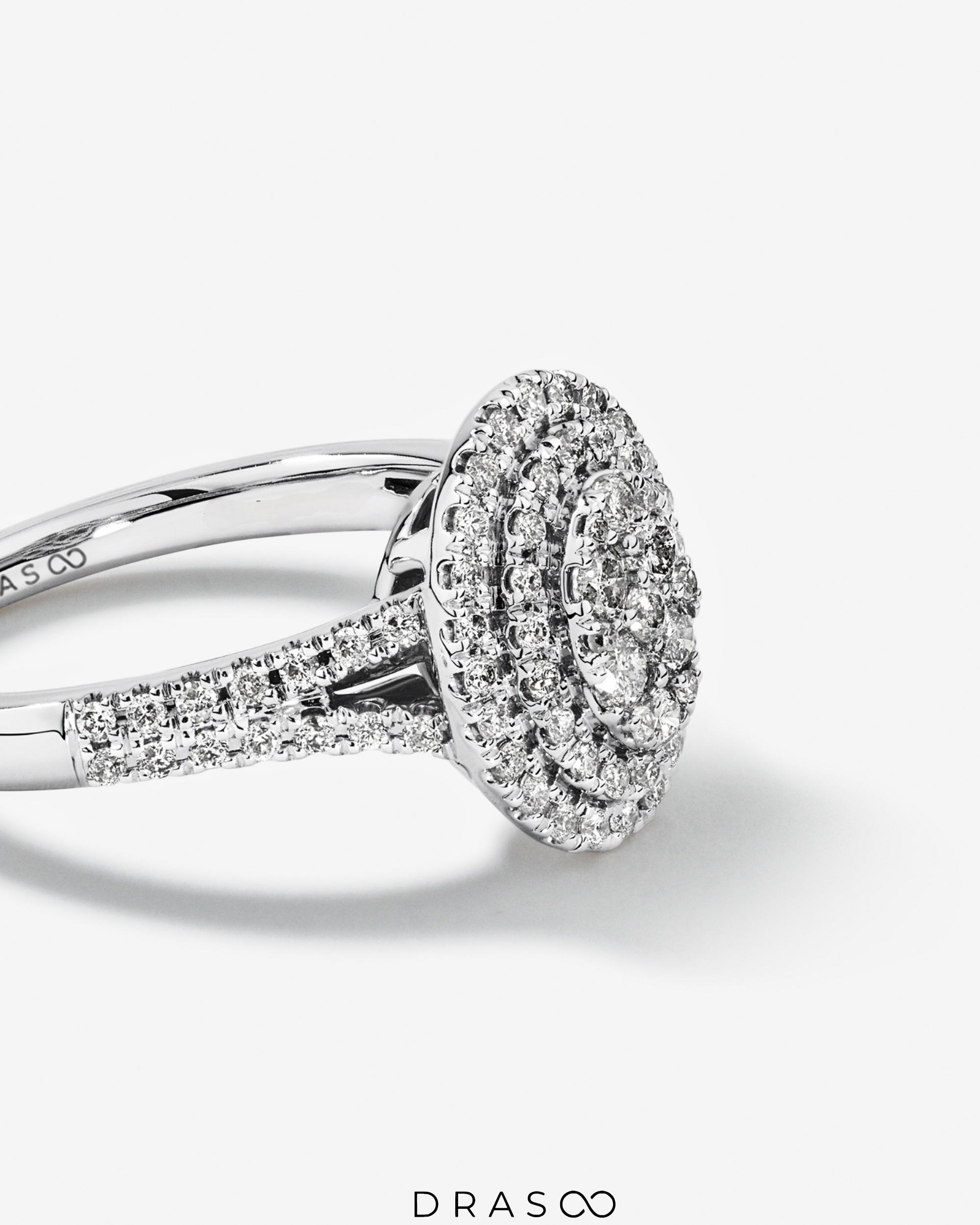 0.65 Carat TW Oval Shaped Cluster Halo Diamond Ring in 10kt White Gold